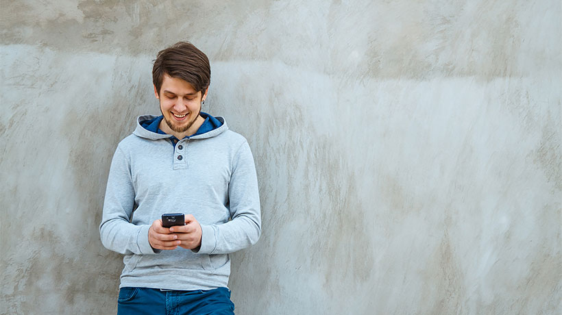 A man uses a smartphone.