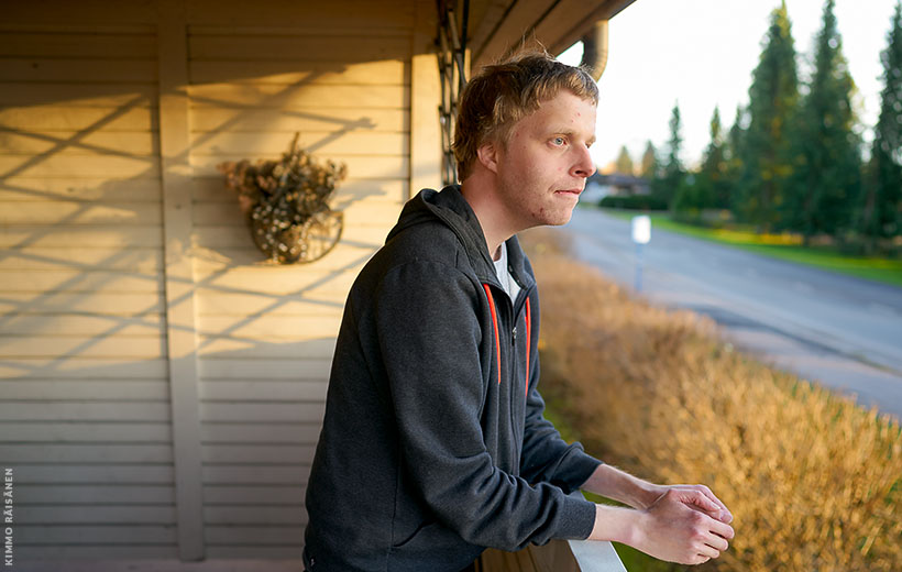 A person looking out from his balcony.